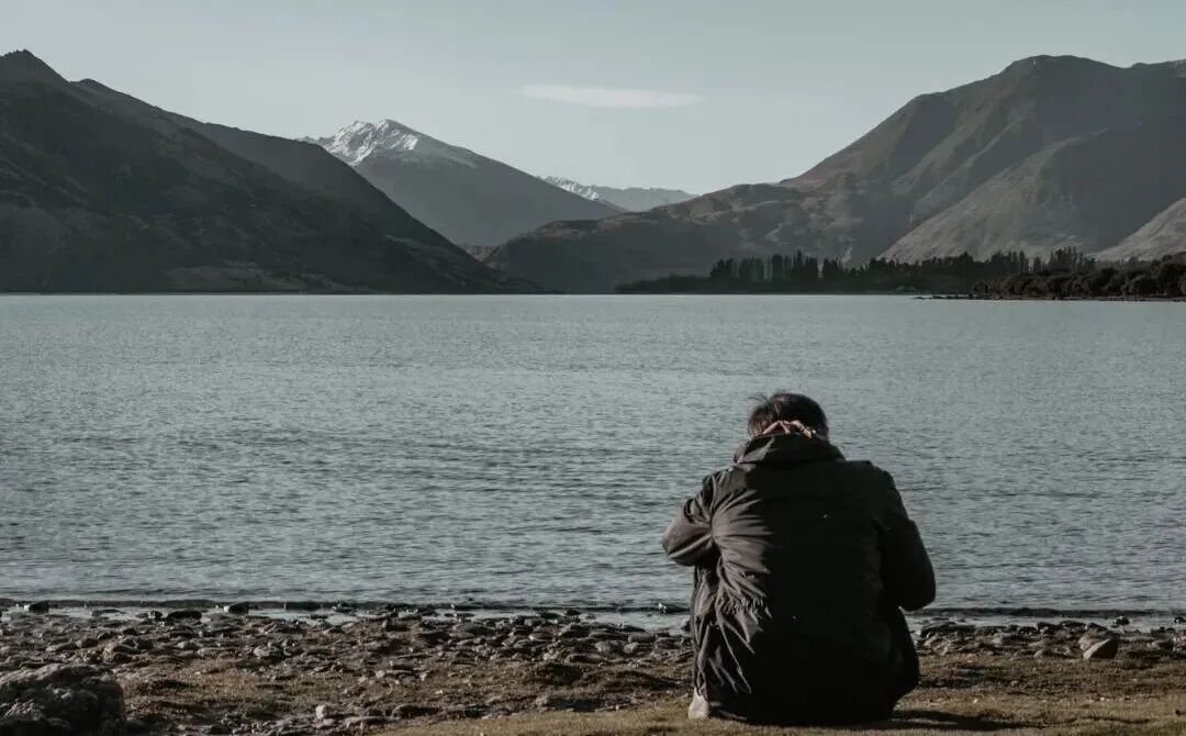 man wearing black jacket